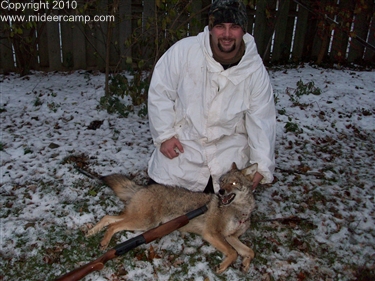 John Hartline with a coyote he shot in 2010