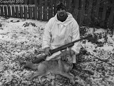 John Hartline with a coyote he shot in 2010, Black and White