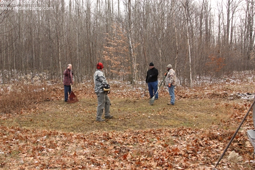 Cleaning up the site with a string trimmer and rakes.pic5