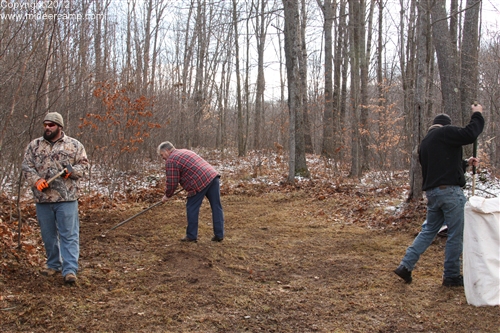 Cleaning up the site with a string trimmer and rakes.pic5a