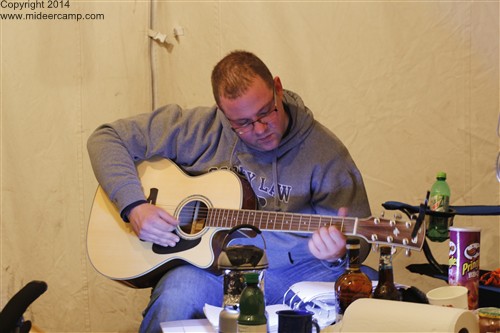Jimbo playing his guitar at Deer Camp