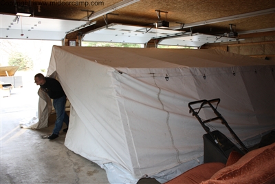 Setting up tent indoors to dry