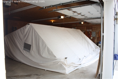 Setting up tent indoors to dry