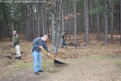 Clearing the Ground with a Weedeater and a Rake